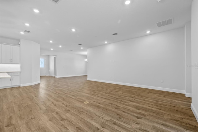 unfurnished living room featuring light hardwood / wood-style floors