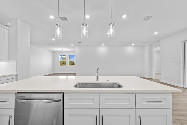 kitchen with decorative backsplash, sink, decorative light fixtures, dishwasher, and white cabinetry