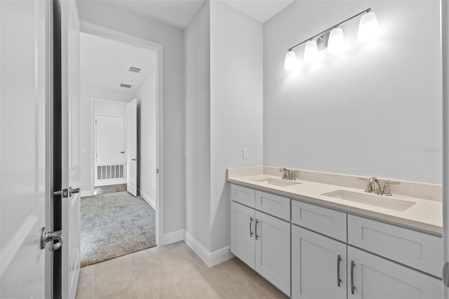 bathroom with tile patterned flooring and vanity