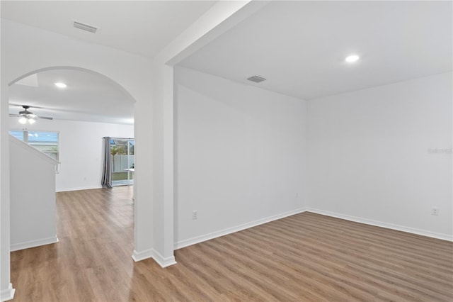 unfurnished room featuring ceiling fan and light wood-type flooring