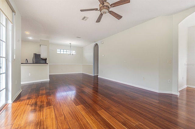 spare room with ceiling fan and dark wood-type flooring