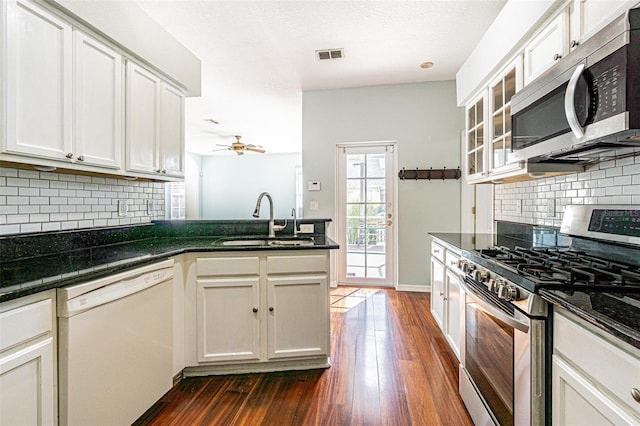 kitchen with ceiling fan, sink, white cabinetry, and appliances with stainless steel finishes