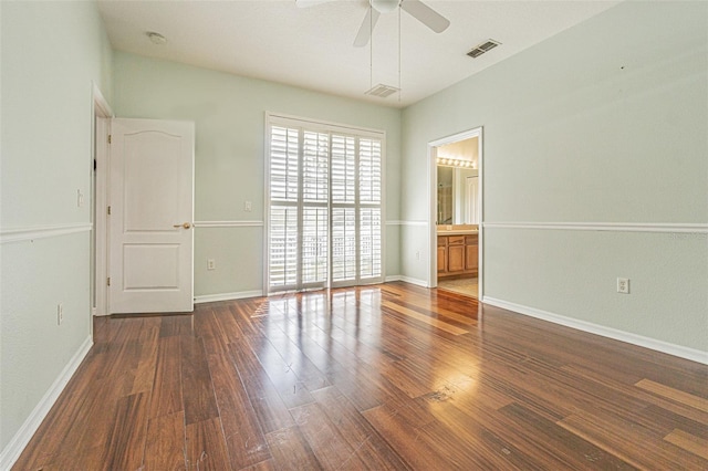 unfurnished room with ceiling fan and dark hardwood / wood-style floors