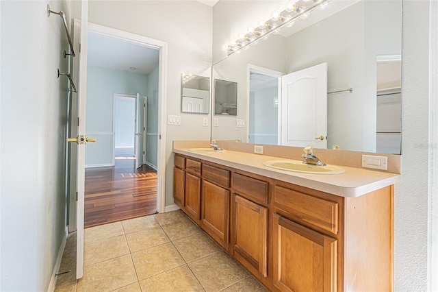 bathroom with vanity and tile patterned flooring