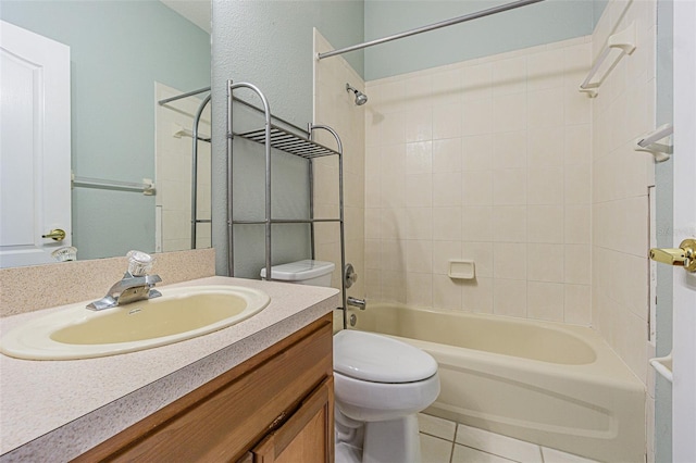 full bathroom featuring toilet, vanity, tile patterned floors, and shower / washtub combination