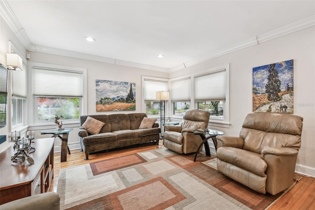 living area with recessed lighting, baseboards, crown molding, and light wood finished floors