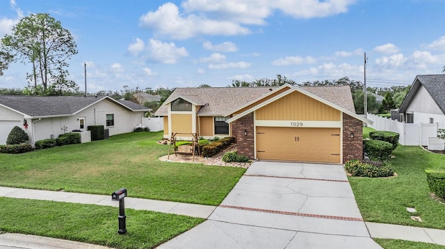 ranch-style home featuring a garage and a front yard