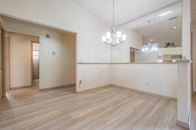 unfurnished dining area featuring a chandelier, light hardwood / wood-style floors, and lofted ceiling