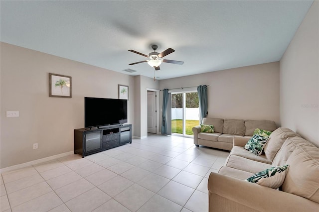 tiled living room featuring ceiling fan