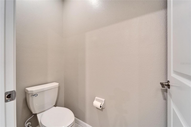 bathroom featuring toilet