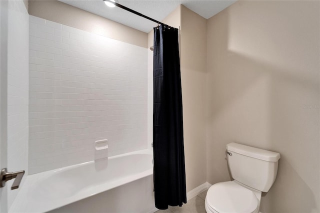 bathroom featuring shower / bath combination with curtain and toilet