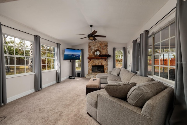 living room with carpet, ceiling fan, lofted ceiling, and a fireplace