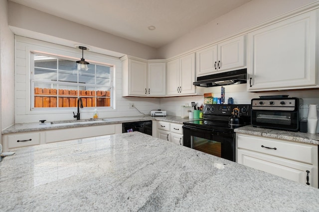 kitchen featuring light stone counters, sink, black appliances, decorative light fixtures, and white cabinets