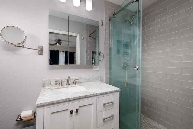 bathroom with vanity and an enclosed shower