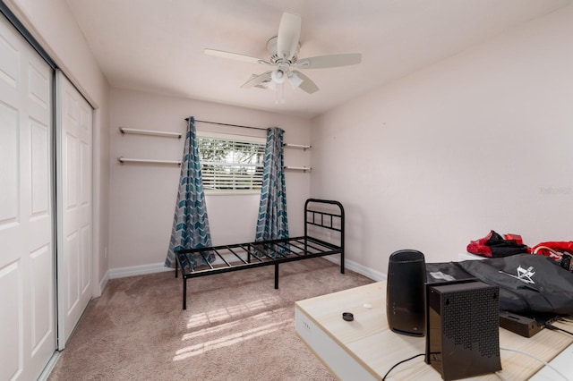 interior space with carpet flooring and ceiling fan