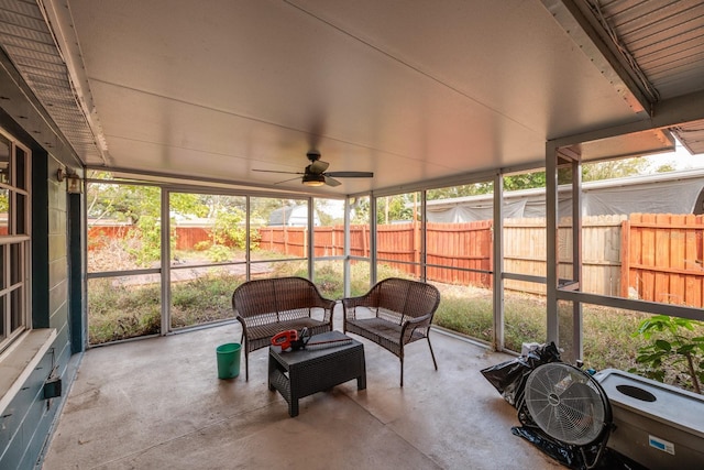 sunroom featuring ceiling fan