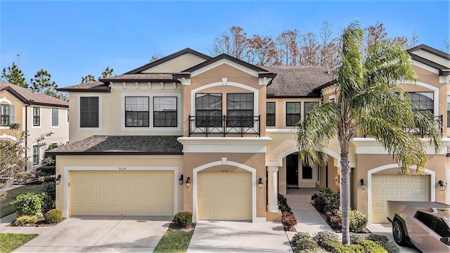 townhome / multi-family property featuring a garage