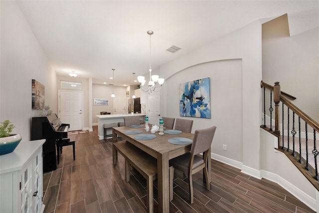 dining area featuring an inviting chandelier