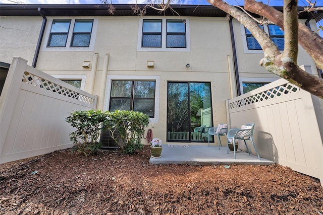 back of house featuring a patio area