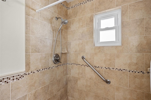 bathroom with tiled shower