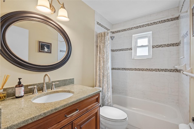 full bathroom with vanity, toilet, and shower / bath combo with shower curtain