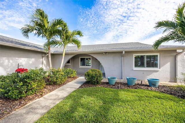 single story home with a front yard