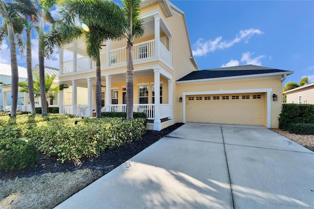 view of front of house with a porch, a balcony, and a garage