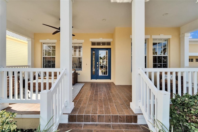 view of exterior entry featuring ceiling fan