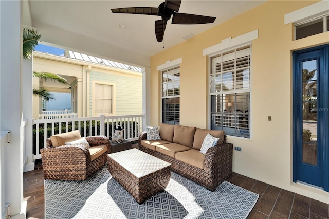 view of patio / terrace with ceiling fan and outdoor lounge area