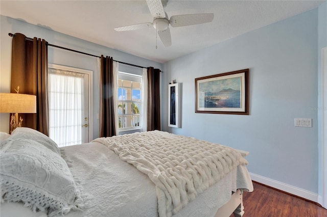 bedroom featuring ceiling fan and dark hardwood / wood-style flooring