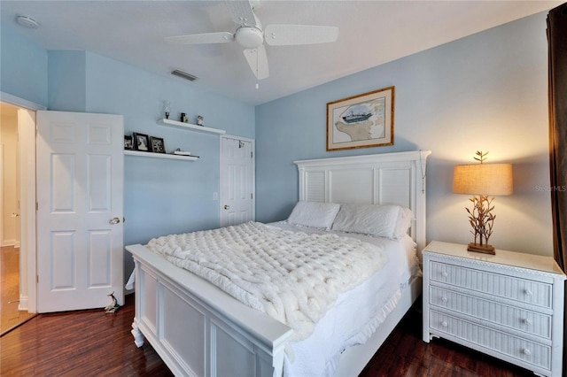 bedroom featuring ceiling fan and dark hardwood / wood-style flooring