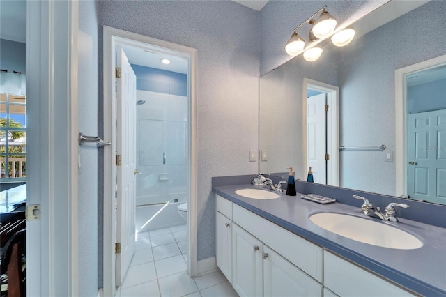 full bathroom with vanity, tile patterned flooring, washtub / shower combination, and toilet