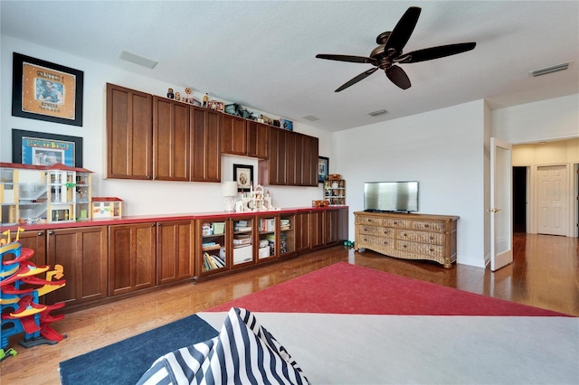 bedroom featuring hardwood / wood-style flooring and ceiling fan