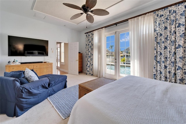 carpeted bedroom featuring multiple windows, ceiling fan, and access to outside