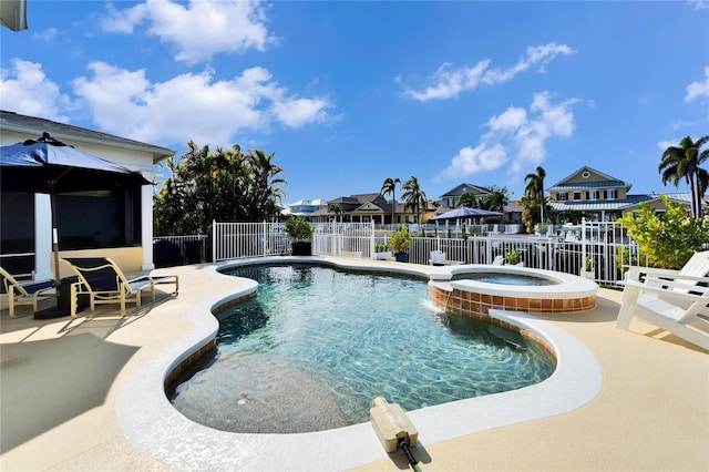 view of swimming pool featuring a gazebo, an in ground hot tub, and a patio area