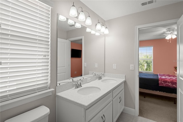 bathroom with vanity, ceiling fan, tile patterned floors, and toilet