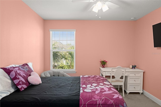 bedroom with ceiling fan and carpet flooring