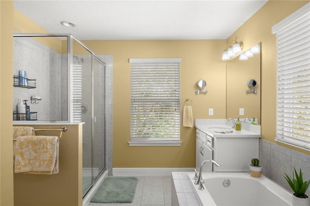 bathroom featuring vanity, tile patterned floors, and separate shower and tub