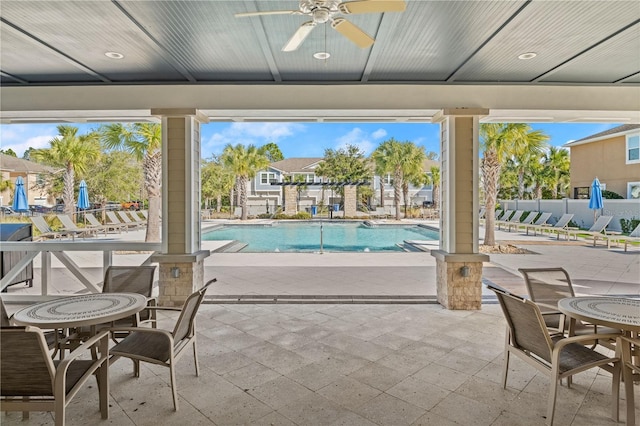 view of pool with a patio area and ceiling fan