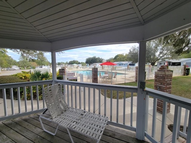 deck with a gazebo and a fenced in pool