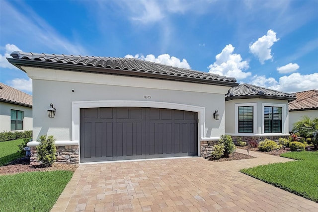 mediterranean / spanish house featuring a garage