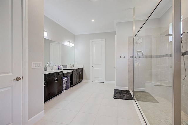 bathroom featuring tiled shower, tile patterned floors, vanity, and ornamental molding