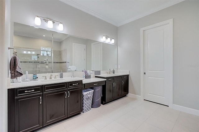 bathroom with a tile shower, vanity, tile patterned floors, and crown molding