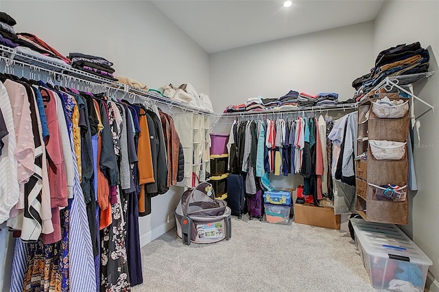 walk in closet featuring carpet floors