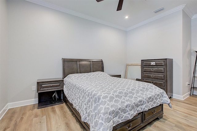 bedroom with ceiling fan, crown molding, and light hardwood / wood-style flooring