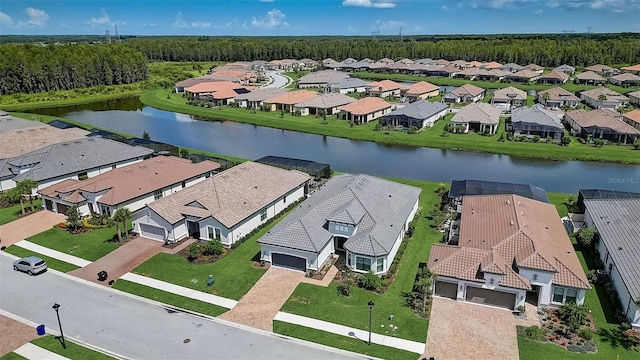 birds eye view of property with a water view