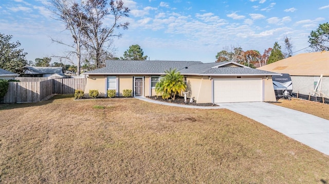 ranch-style home with a front lawn and a garage