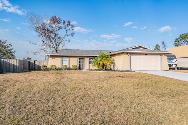 ranch-style house featuring a front lawn and a garage