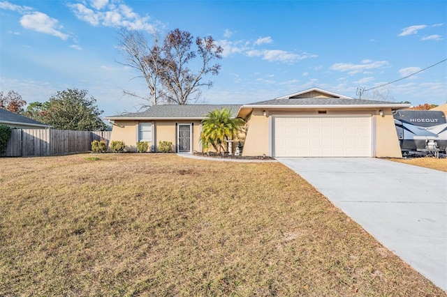 single story home featuring a front lawn and a garage