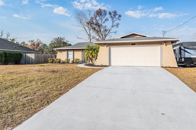 ranch-style house featuring a front yard and a garage